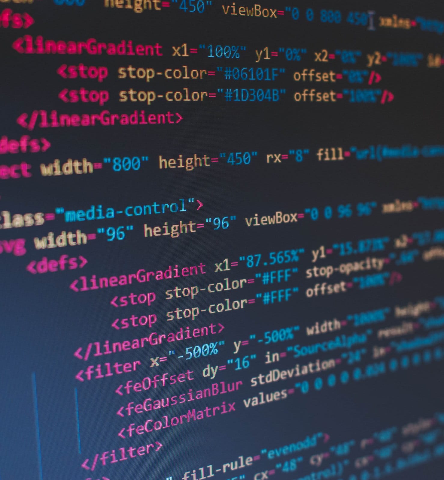 Close-up of website code displayed on a computer monitor during web development